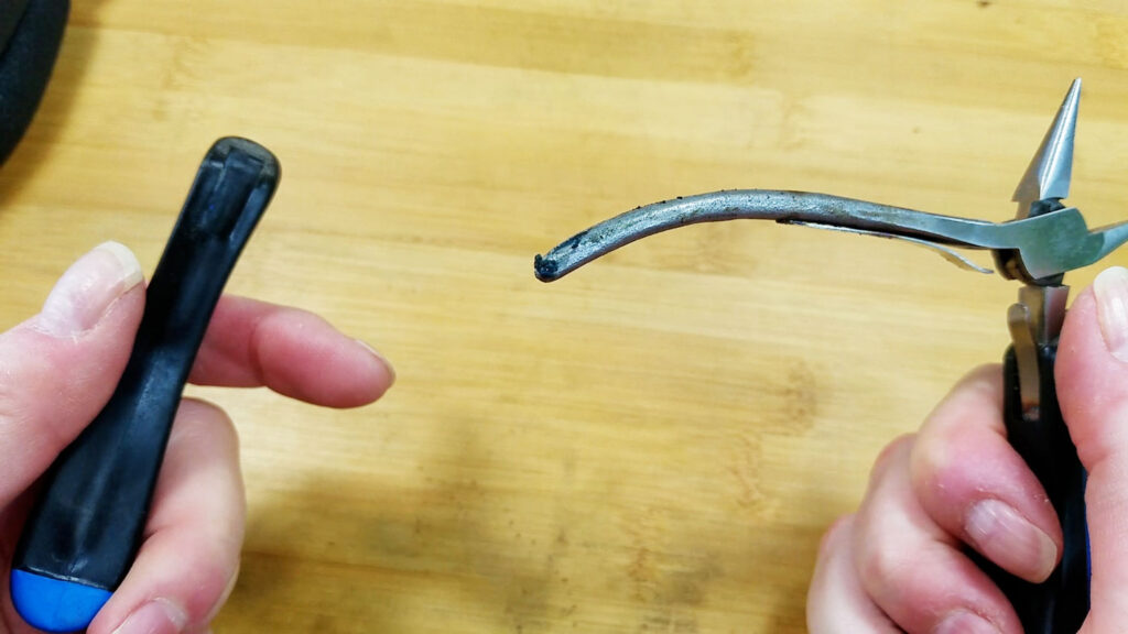 An image showing how the adhesive has failed and the grips can easily be pulled off of the author's old jewelry pliers.