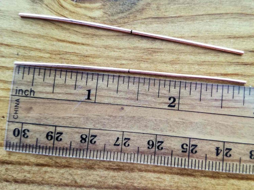Step 4 - Measure and cut two pieces of 18ga wire to 2.5 inches long. Mark the center points of your core wires, as shown. 