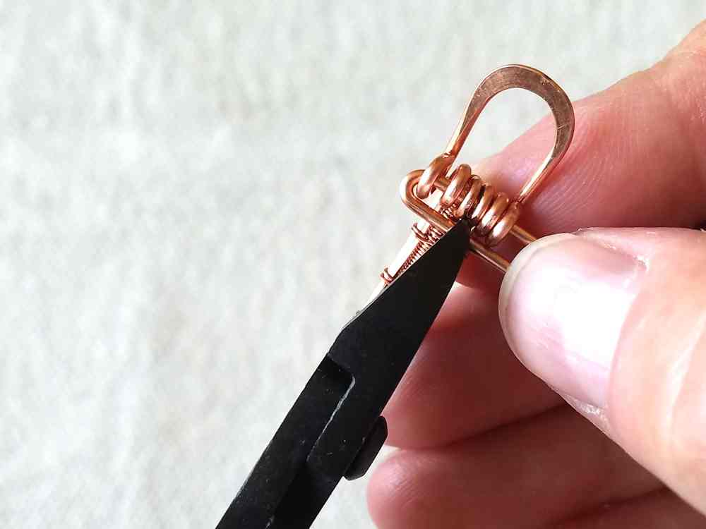 Step 33 - Attach the loop component of the clasp to your woven band using one of the hinge pins.