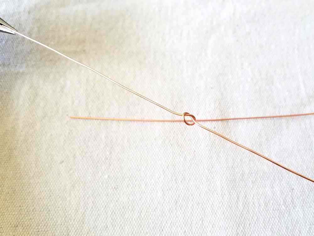 Step 4 - use two pairs of pliers to pull your knot tight
