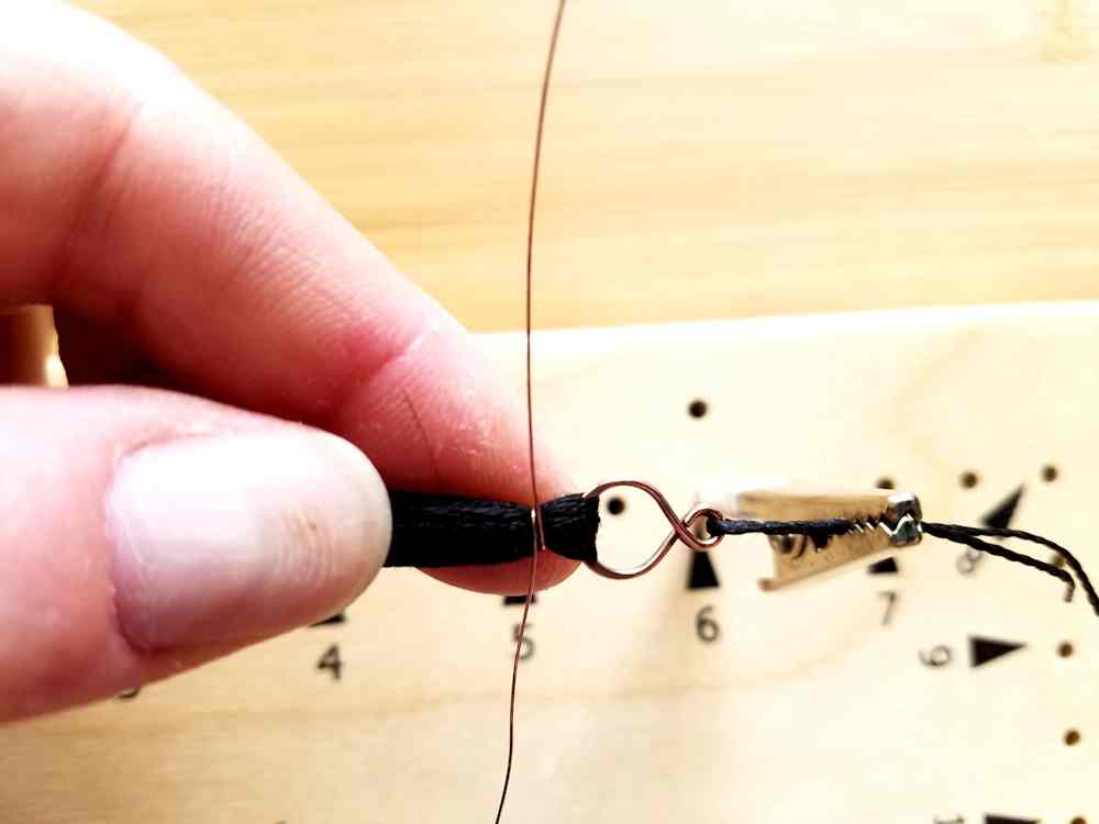Step 19 - Begin wrapping the tassel fibers with 28g wire.