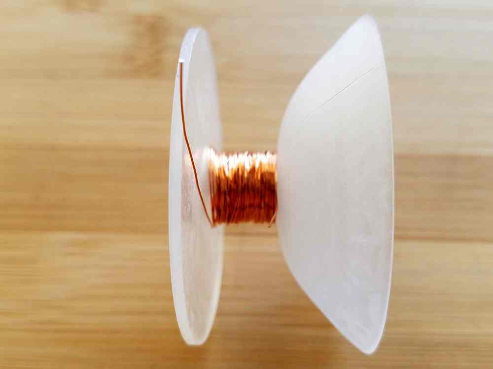 Step 1 - prepare your weaving wire. I wind my weaving wire onto a plastic Kumihimo bobbin, as shown. 