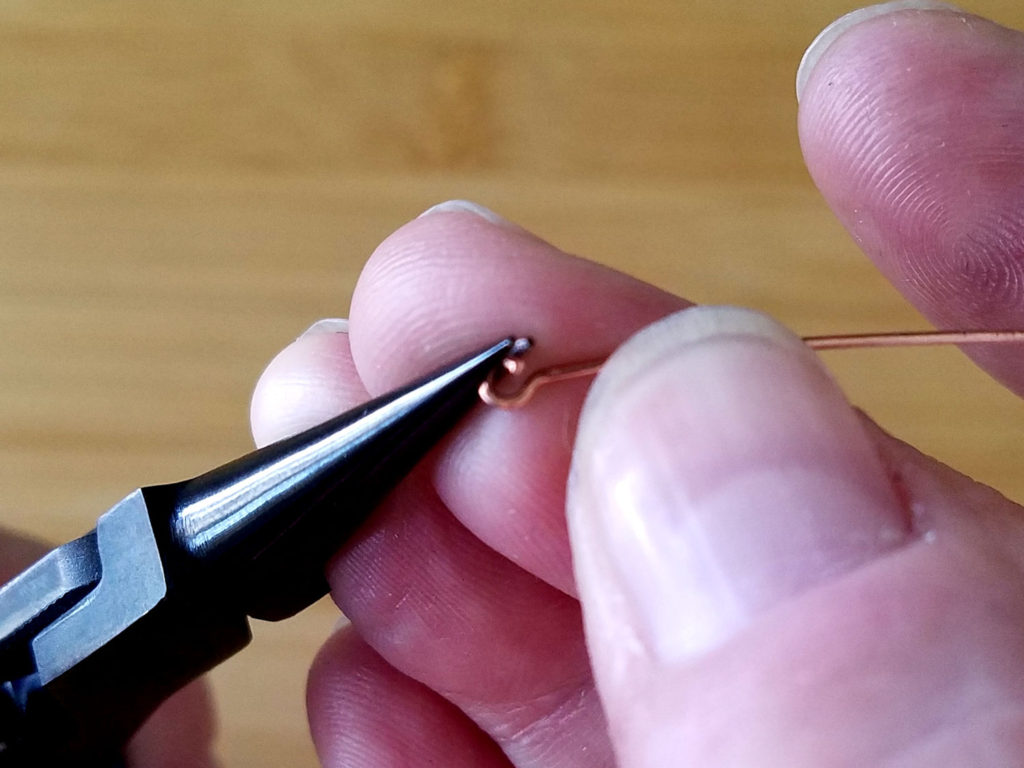 Step 2 - Open the simple loop on the headpin, as shown.