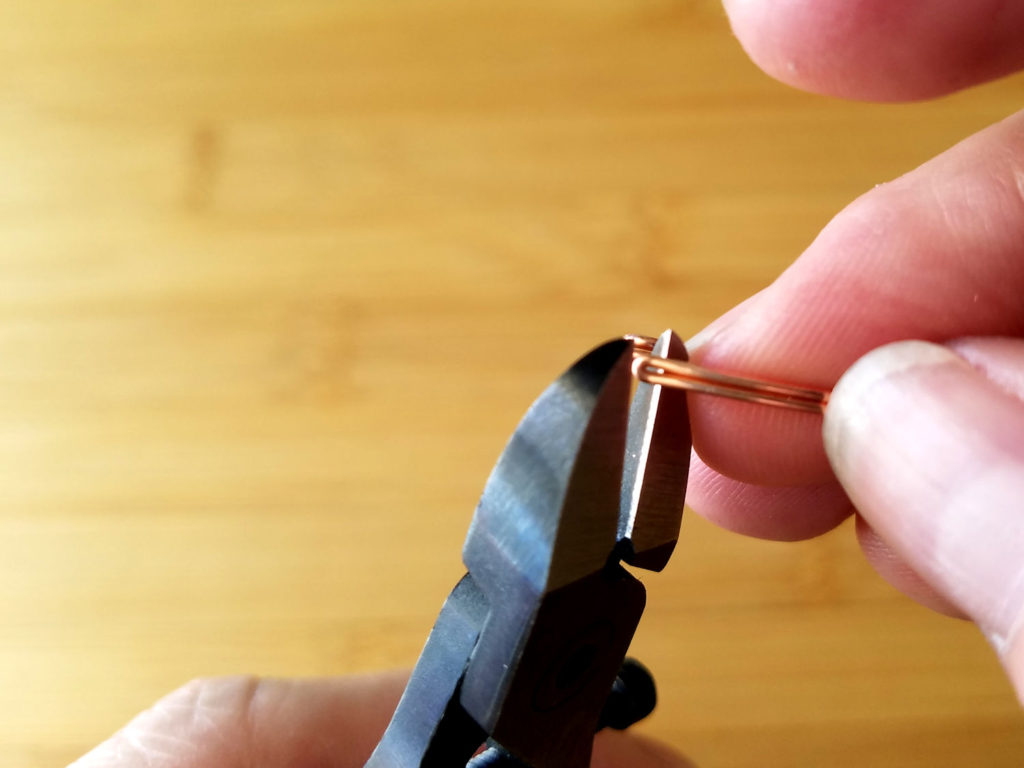 Step 9 - Use your wire cutters to trim off the fold, as shown. This will release your matched Marquis ear wires.