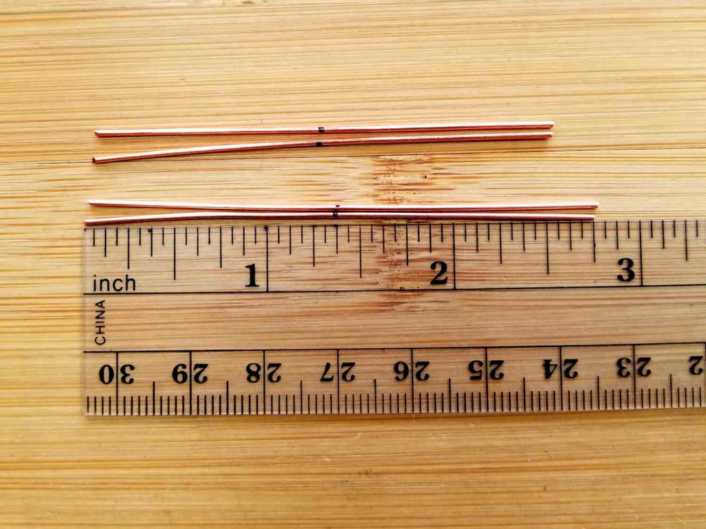 Form the bead Frames, Step - Measure and cut four 20ga wires as instructed. Mark the center point of each wire, as shown. 