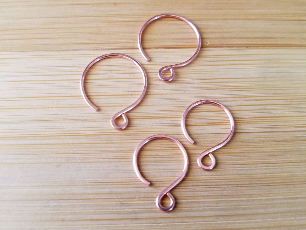 Your finished circle ear wires will look something like those pictured here. The 12mm ear wires are shown on the top left. The 9mm ear wires are shown on the bottom right.