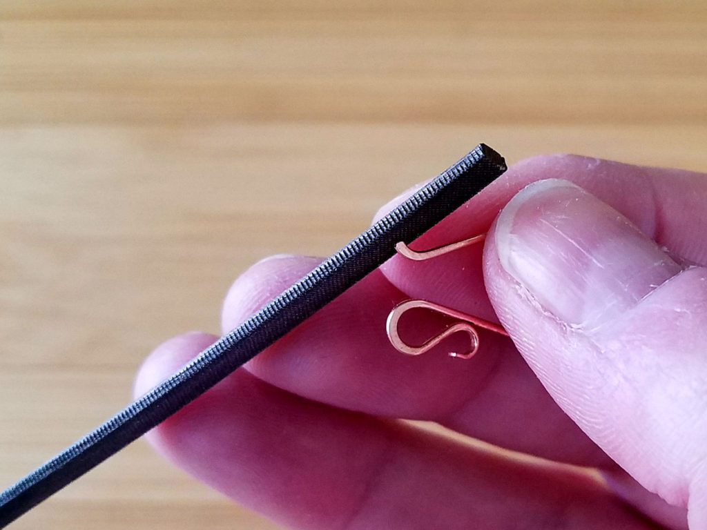 Step 17 - Use a needle file to shape and smooth the hook ends of the Flourish Ear Wires, as shown.
