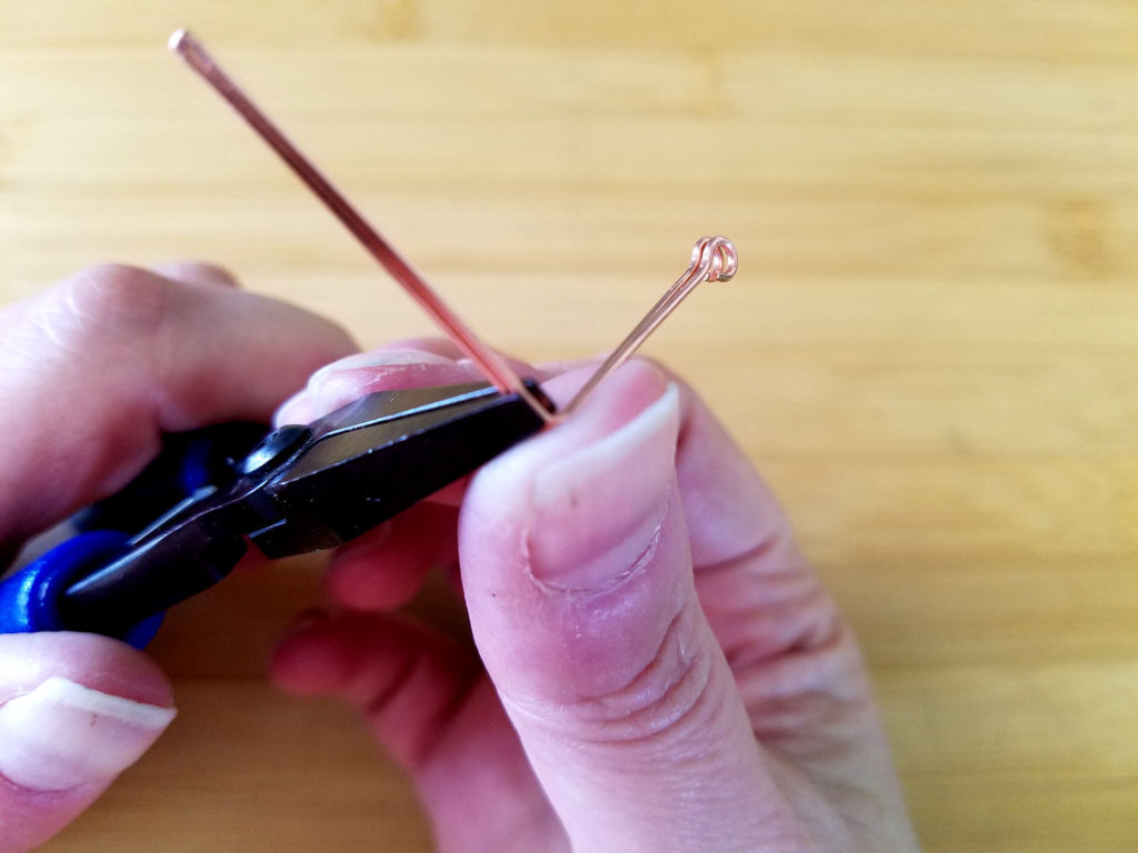 Step 11 - Use your thumb to form a 90-degree angle on your wires, as shown. 