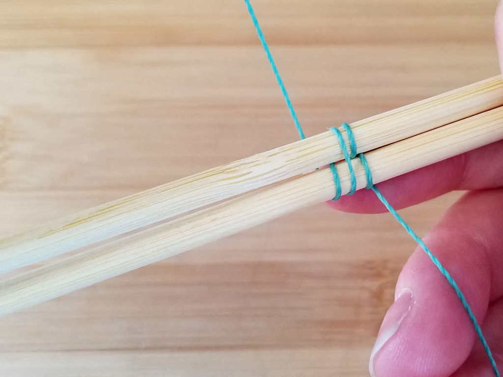 Step 7 - Bring the weaving wire up behind Core 2, as shown.