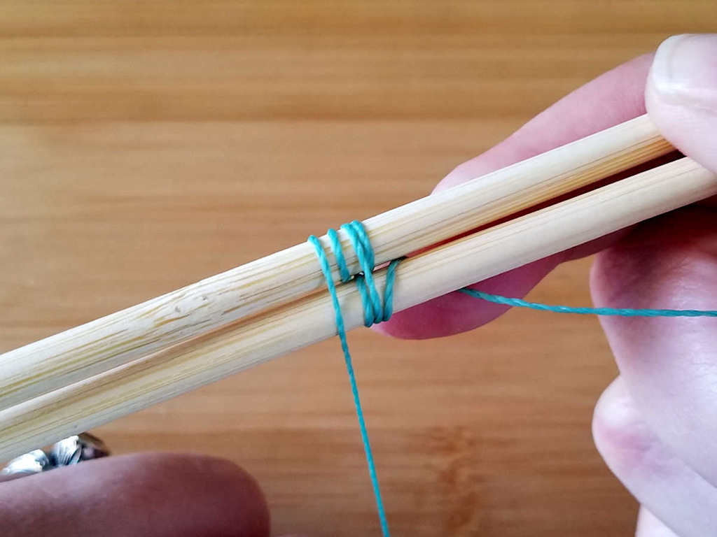 Step 9 - Bring the weaving wire down over both core wires to complete your second pattern repeat, as shown.