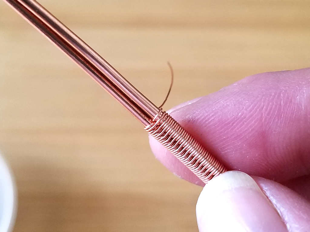 Step 1 - Compact your weave and make sure you have at least a one-inch tail on your wold wire, as shown. 