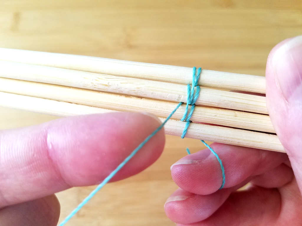 Secure the second double wrap by bringing the weaving wire to the front between wires 2 and 3, as shown.