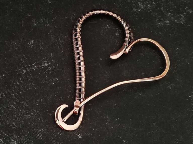 An elegant wire wrapped heart pin made in solid copper. Designed and crafted by Wendi Reamy of Door 44 Studios