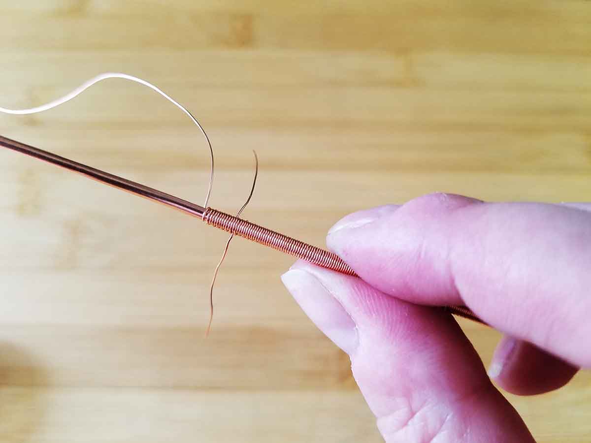 An image of a segment of wire weaving with multiple wire tails sticking out of it