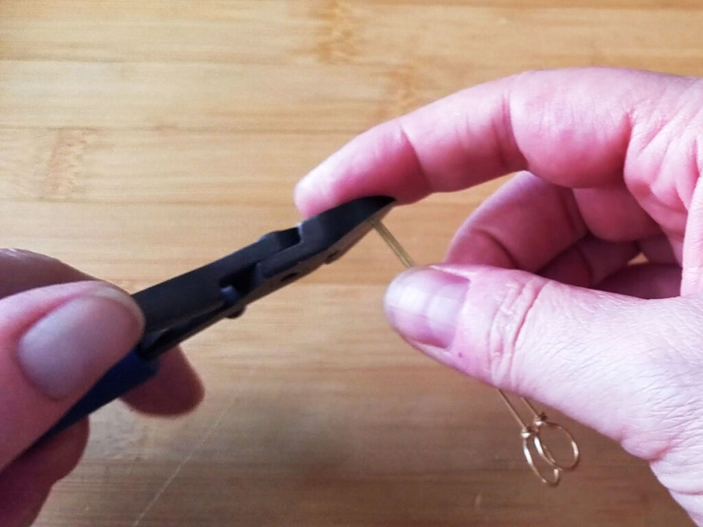 Using super flush wire cutters to trim the ends of the two wires evenly